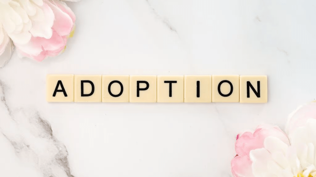 Scrabble tiles spelling adoption